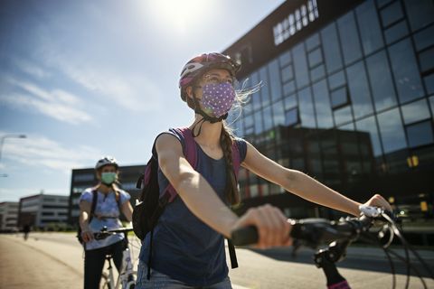 woman-riding-bike-with-mask