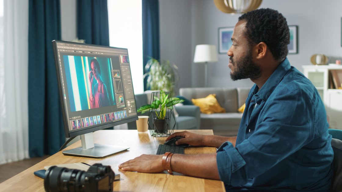 man-editing-photos_how-to-style-and-brand-your-group
