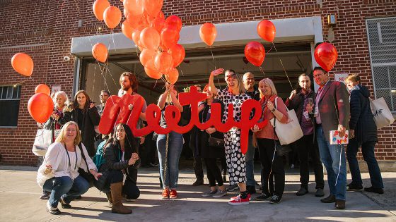 Meetup sign with balloons