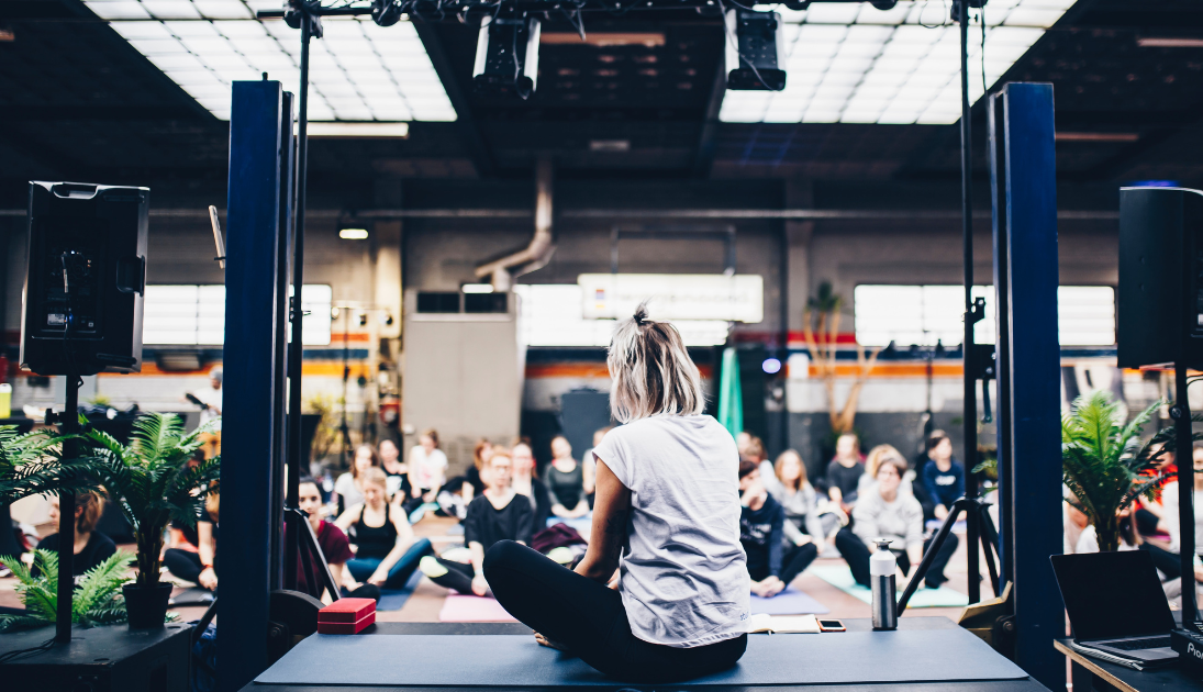 Woman leading a yoga workshop